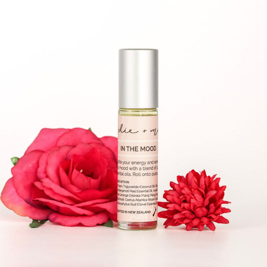 Indie + Mae | Aromatherapy Roller |  with red flowers on a white background